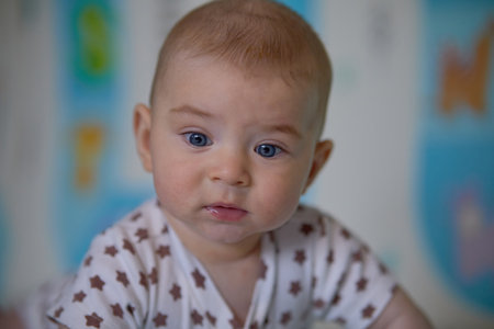 Portrait of a cute baby boy. Shallow depth of field.の写真素材