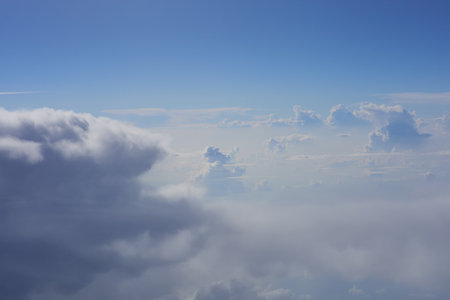 clouds in the blue sky, view from airplane window, nature backgroundの写真素材