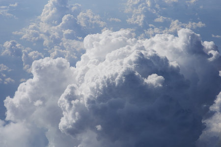 Cloudscape, view from the airplane window to the vast blue sky.の写真素材