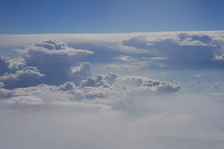 Cloudscape, view from the airplane window, blue sky and white cloudsの写真素材