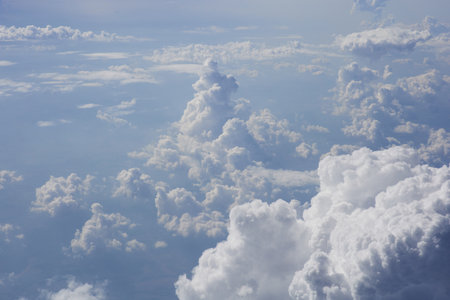 Clouds and sky as seen through window of an airplaneの写真素材