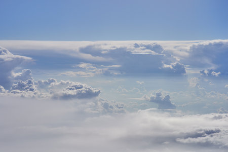 Blue sky and white clouds. View from airplane window. Nature backgroundの写真素材