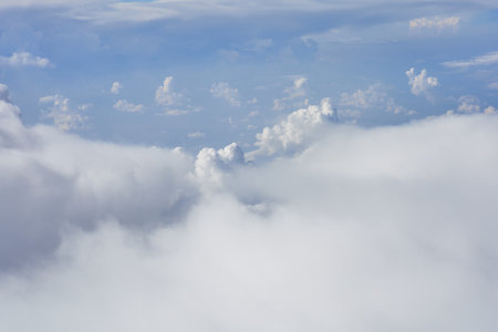 Cloudscape, view from the airplane window on white fluffy clouds.の写真素材
