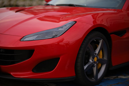 Close-up of a red sports car in the parking lot.の写真素材