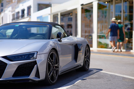Luxury convertible car parked in the street.の写真素材