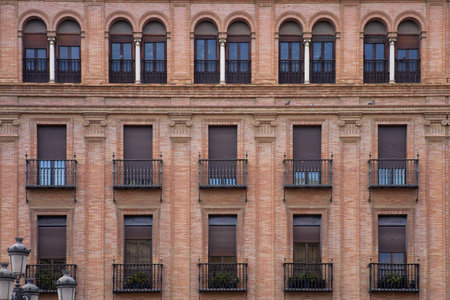 Facade of a building with balconies in Barcelona, Spain.の写真素材