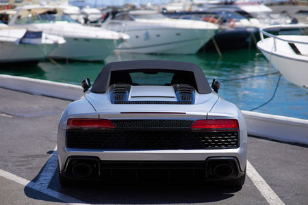 Luxury sport car on the background of yachts.の写真素材