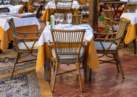 Tables and chairs in a restaurant terrace in Athens, Greeceの写真素材