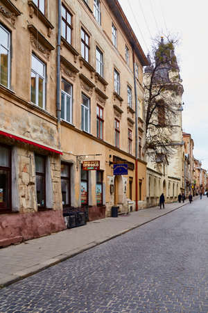 Lviv, Ukraine - November, 2017. The prospect of an old street in the center of Lviv with old buildings. People are walking along a beautiful city.のeditorial素材