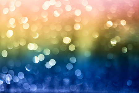 Defocused of multicolor LED light on black background. Bokeh photo of LED light. Green and purple....