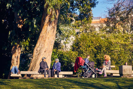 Lisbon, Portugal - January, 2018. Gulbenkian park and garden. People relax in the garden and enjoy sunny weather. Families came to the park on holiday for the weekend and to make picnic in the gardenのeditorial素材