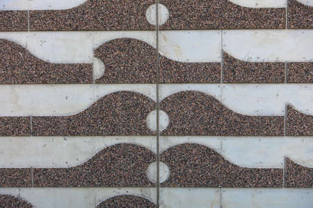 Concrete wall with small rocks on the surface