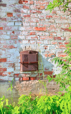 Ash hatch on the side of an old farm houseの写真素材