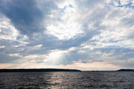 Sun shining thru cloudsの写真素材