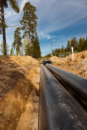 New district heating pipes laid on the groundの写真素材