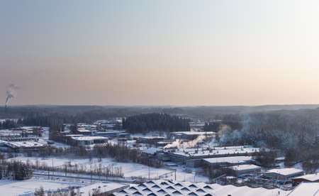 Industrial area on a winter day on the edge of a forestの写真素材