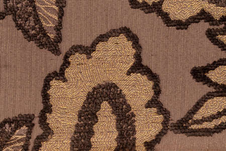 Furniture cover made of brown fur and yellow base forming an leaf patternの写真素材