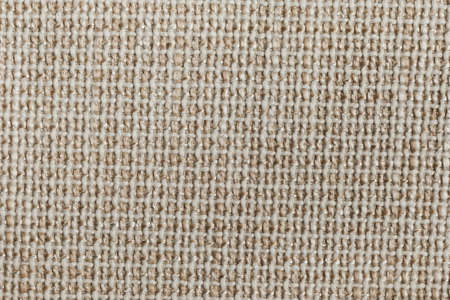 Furniture cover made of white, light brown strings on a white base