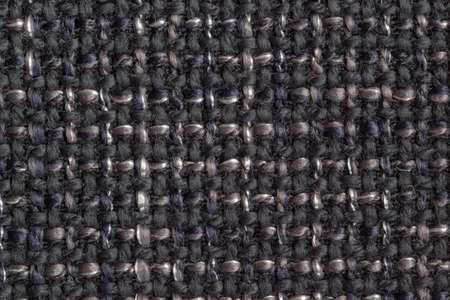 Furniture cover made of gray, dark blue and black strings