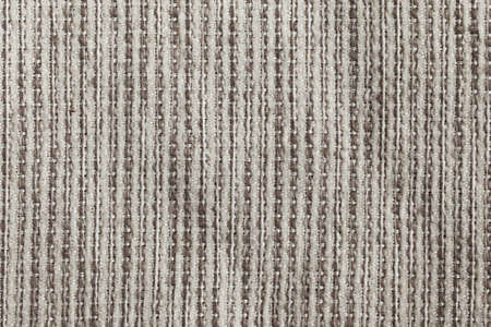 Furniture cover made of white fur and light brown strings
