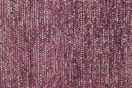 Furniture cover made of dark pink fur with white strings