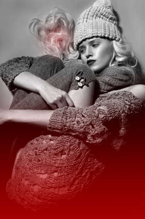 The glamour blond girl on a gray background