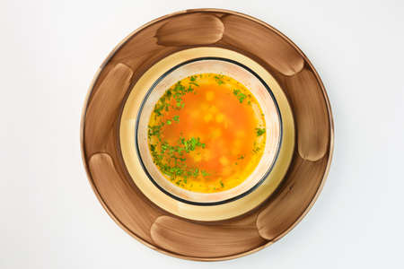 Bavarian fresh vegetable soup on a white backgroundの写真素材