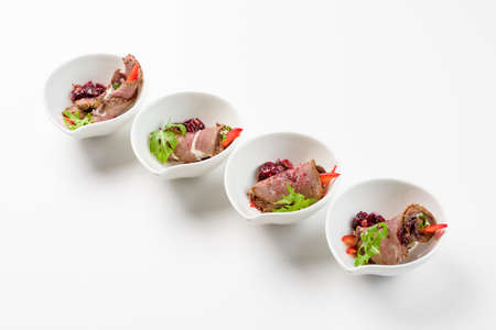 Meat loafers with salad on a white background
