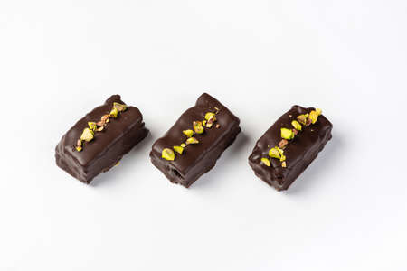 Candy in chocolate glaze on a white background