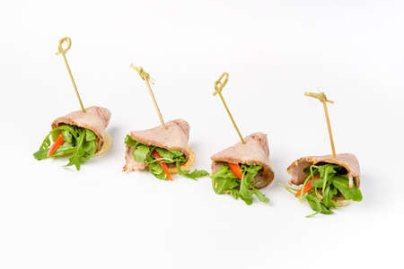 Snack canapes to the buffet on a white background