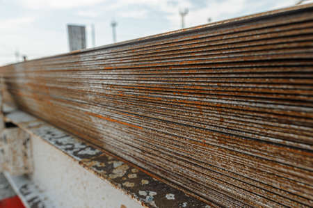 Steel sheets in warehouse. Piles of steel metal in stock