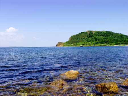 Russian island in warm sea of Japan in a sunny dayの写真素材