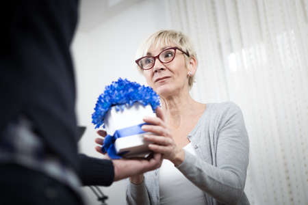 Flowers are nice, but she was expecting something else.の写真素材