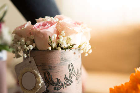 a decorative box , full of beautiful pink roses.の写真素材