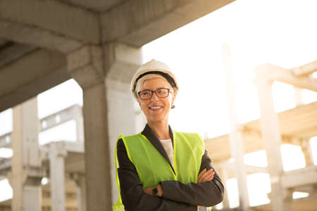 A successful young female engineer, proud and satisfied with the completed job.