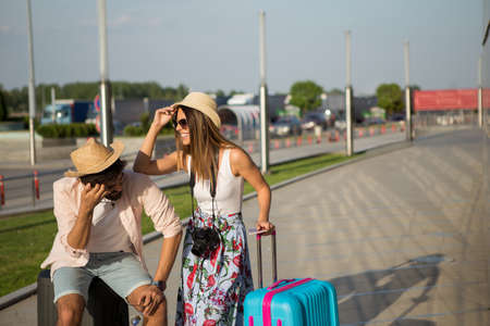 They came to the airport too early, because they read the wrong flight schedule.の写真素材