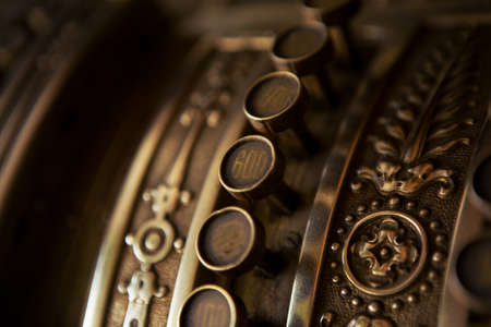 The selective focus on the buttons on the old 19th coffers is closer. The button is worn a lot but numbers are still visible.の写真素材