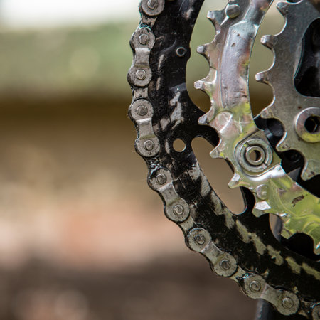 Close-up of gears and a chain to drive a bicycle. The chain is dirty and greasy. Copy spaceの写真素材