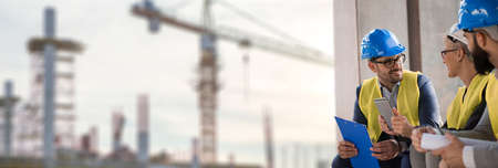 The investor listens to the presentation of a beautiful young female architect She's beautiful and he likes she a lot.And behind in the distance you can see the construction site and construction cranesの写真素材