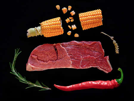 Meat and corn with pepper before cookingの写真素材