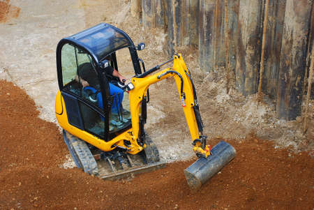 Small yellow excavator 