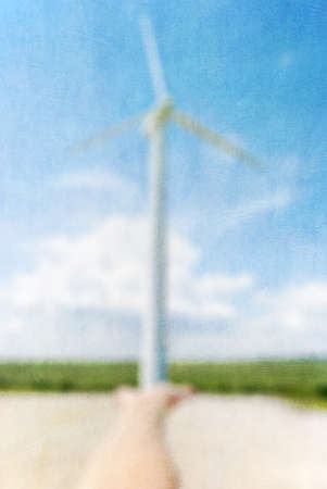 Retro image  Hand of a wind turbine  Paper texture 