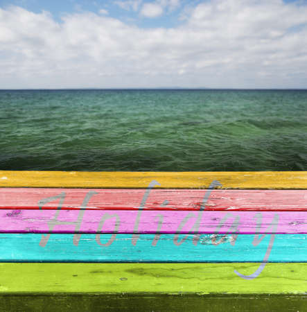 Blank Colorful wooden table  The table above sea green background My holiday inscription on the table の写真素材
