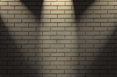 White brick wall with three light spotsの写真素材