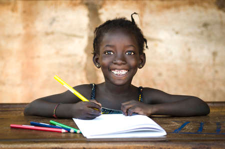 Education Symbol: Big Toothy Smile on African School Girl