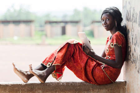 Business Person Working In School for Lesson (African Student Typing)の写真素材