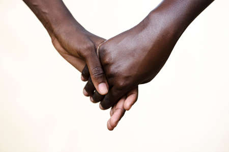 Friendship Symbol: Black People Holding Hands Together. Symbol for fight against racism, peace for the world!の写真素材