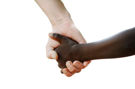 African and caucasian hands holding together isolated on white backgroundの写真素材