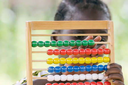 African girl counting on abacus education symbolの写真素材