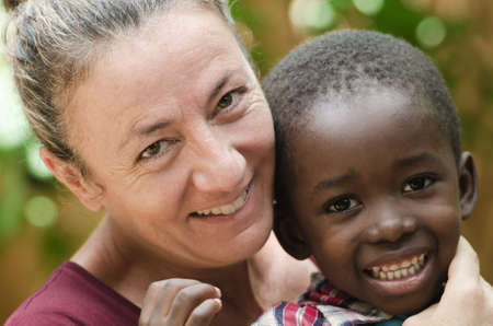Gorgeous woman with a black babyの写真素材